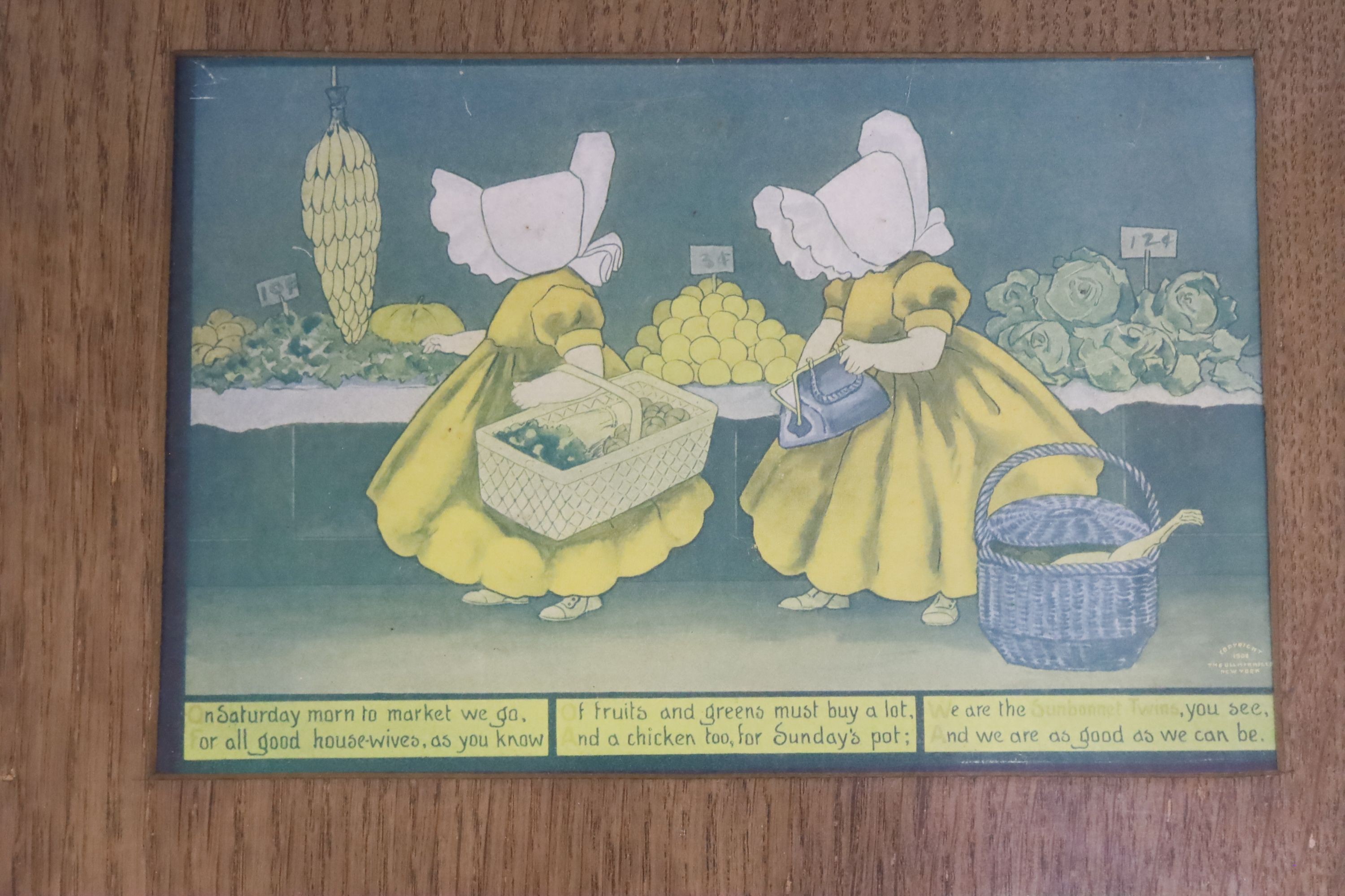 A set of seven sunbonnet twins oak framed 'days of the week' litho prints copyright 1905 by the Ullman mfg Co. New York